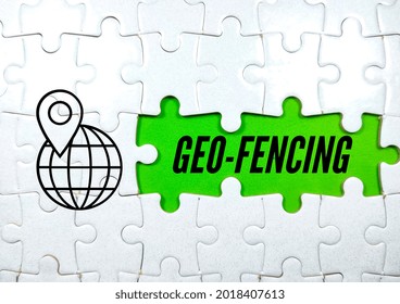 Business concept.Text GEO-FENCING with simple icon with jigsaw puzzle on green background.