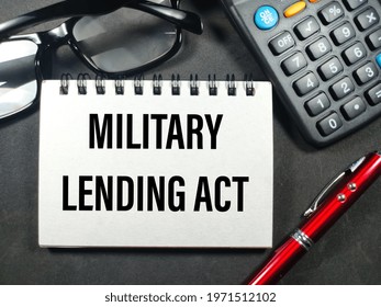 Business Concept.Text MILITARY LENDING ACT With Pen,calculator And Glasses On Black Background.