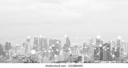 Business Connection In The City With Digital Graphic Link Network Internet Of Things And Information Communication Technology Buildings Black And White Background