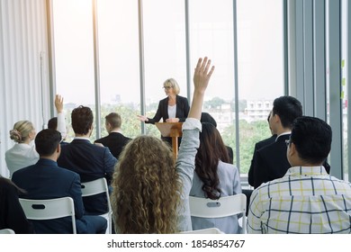 Business consultant answering a question during a meeting at office with participation involvement of teamwork and leadership opinion.