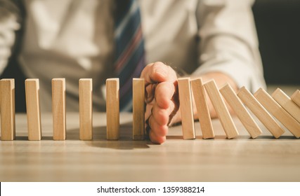 Business control concept by stopping domino effect - Shutterstock ID 1359388214