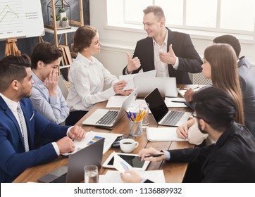 Business corporate meeting of successful team. Young cheerful people brainstorming, discussing new startup project in office, copy space - Shutterstock ID 1136889932