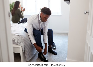 Business Couple In Bedroom Getting Ready For Work Businesswoman At Home Putting On Shoes