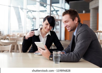 Business couple meeting with digital tablet