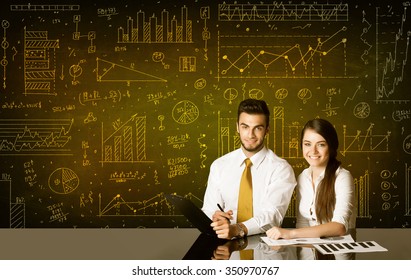 Business couple sitting at black table with hand drawn diagram background - Powered by Shutterstock