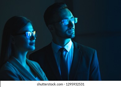 The Business Couple Standing In The Dark Room