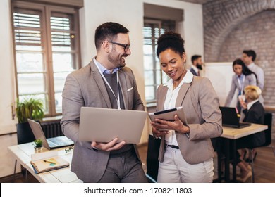 Business coworkers discussing new ideas and brainstorming in a modern office - Shutterstock ID 1708211803