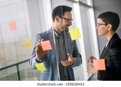 Business Coworkers Discussing New Ideas And Brainstorming In A Modern Office