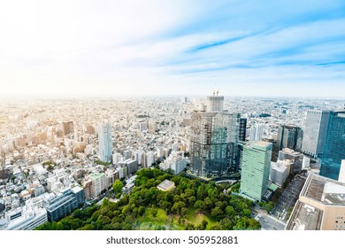 Business And Culture Concept - Panoramic Modern City Skyline Bird Eye Aerial View Under Dramatic Sun And Morning Blue Cloudy Sky In Tokyo, Japan