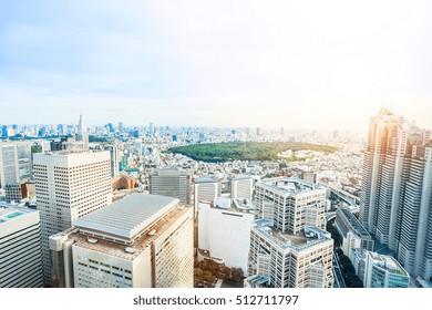 Business And Culture Concept - Panoramic Modern City Skyline Bird Eye Aerial View Of Meiji Shrine Under Dramatic Sun And Morning Blue Cloudy Sky In Tokyo, Japan