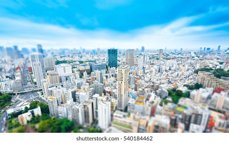 Business And Culture Concept - Panoramic Modern City Skyline Bird Eye Aerial View From Tokyo Tower Under Dramatic Sunny And Morning Blue Cloudy Sky In Tokyo, Japan. Miniature Tilt-shift Effect