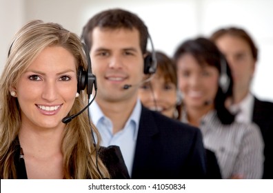 Business Customer Support Team In An Office With Headsets