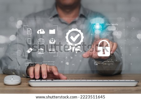 Business cybersecurity concept Business Warranty and Data Retention, Businessman fingerprint to access the security system. in data management on computer screen with keyboard on table