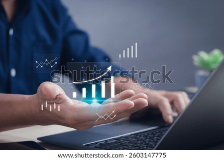 Business data analysis concept with statistical graphs, workflow on dashboard, business performance evaluation and measurement. Man's hand at data analysis graph working on computer on virtual screen.