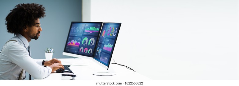 Business Data Analyst Using Computer. African American Advisor