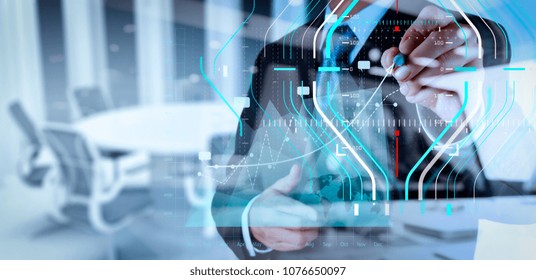 Business data analytics process management diagram.double exposure of businessman hand working with new modern computer and business strategy as concept