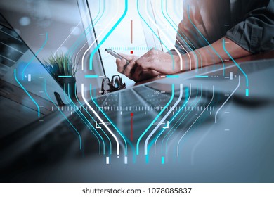 Business data analytics process management diagram.businessman hand working with new modern computer and smart phone and business strategy on wooden desk as concept