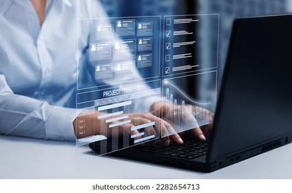 Business data management system concept background. Business person working on computer updating tasks and milestones progress, complete the online survey form.            - Shutterstock ID 2282654713