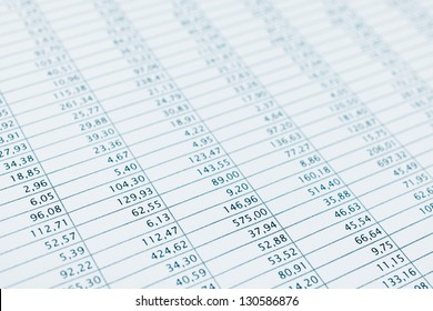 Business Data Report Selective Focus Close Up. Monthly Stock Stats Spreadsheet. Blue Toned.