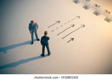 Business decision concept. Businessman thinking with many arrow path. - Shutterstock ID 1910801503