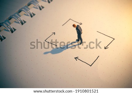 Business decision concept. Businessman thinking with many arrow path.