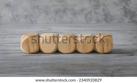 Business  design concept.  Five abstract geometric wooden blank dice isolate on white rustic surface.
