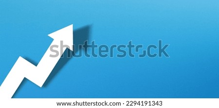 Business development and growth concept with white paper arrow on blue background