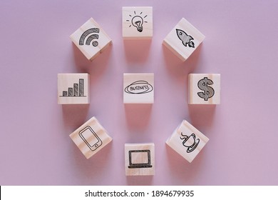 Business development strategy and Action plan concept, wooden blocks with business process management icons on a pink background, copy space