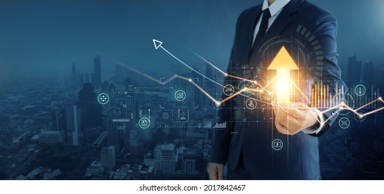 Business development to success and growth of banking and financial on global network. Businessman hold pointing arrow up and graph corporate future growth plan on network structure of business.  - Shutterstock ID 2017842467