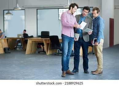 Business development team planning company growth and strategy at the office. A group of casual IT employees planning and working together on a technology startup at the workplace - Shutterstock ID 2188929625