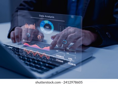 Business development and technology Data analyst for report marketing strategy planning. graph analysis and information on a futuristic virtual interface screen.