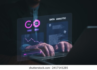 Business development and technology Data analyst for report marketing strategy planning. graph analysis and information on a futuristic virtual interface screen.