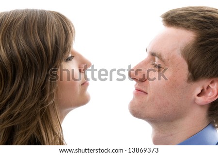 Similar – Man and woman face each other