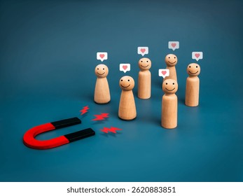 Business digital marketing, social network engagement, attract leads and customers concept. Human figure with love icons attracted by magnet on blue background. Team building, recruitment concept.