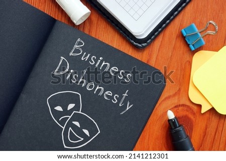 Business dishonesty is shown on a photo using the text