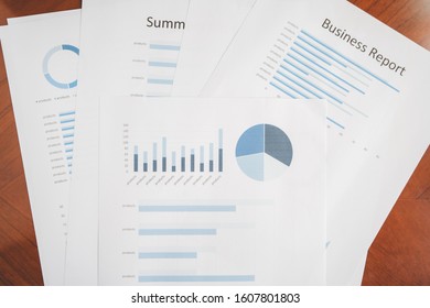 Business document report data with bar charts, pie charts, line graphs, on paper. Research data for market analysis and corporate financial planning.