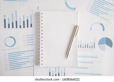 Business document report data with bar charts, pie charts, line graphs, on paper. Research data for market analysis and corporate financial planning.