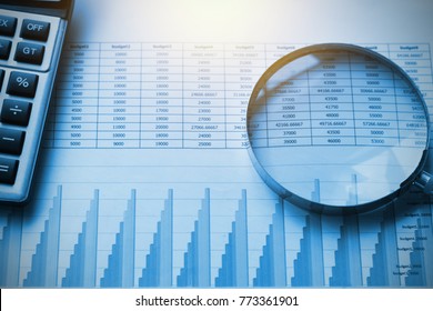 business documents accounting with calculator and magnifying glass. concept for financial - Shutterstock ID 773361901