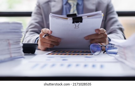 Business Documents, Auditor businesswoman checking searching document legal prepare paperwork or report for analysis TAX time,accountant Documents data contract partner deal in workplace office - Shutterstock ID 2171028535