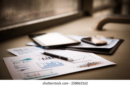 business documents with charts growth, keyboard and pen. workplace businessman - Powered by Shutterstock