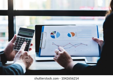 Business documents on office table with smart phone and digital tablet and graph financial. - Shutterstock ID 1042656214