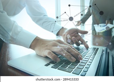 business documents on office table with smart phone and digital tablet and stylus and two colleagues discussing data in the background - Shutterstock ID 289415333