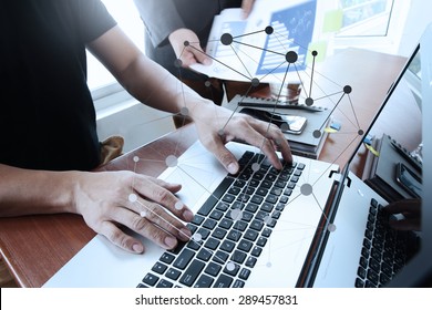 business documents on office table with smart phone and digital tablet and laptop computer and two colleagues discussing data in the background - Shutterstock ID 289457831