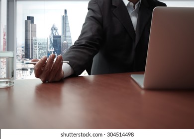 business documents on office table with smart phone and digital tablet and graph business diagram and man working in the background with london city view - Shutterstock ID 304514498