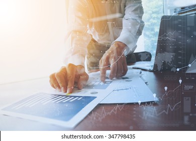 business documents office table and smart phone   digital tablet   graph financial and social network diagram   man working in the background
