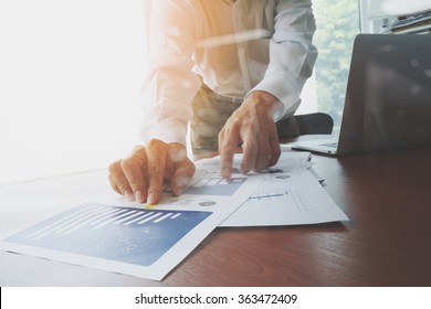 business documents on office table with smart phone and digital tablet and graph finance with social network diagram and man working in the background - Shutterstock ID 363472409