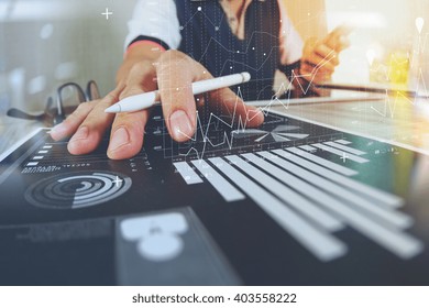 business documents on office table with smart phone and digital tablet and graph finance with social network diagram and man working in the background