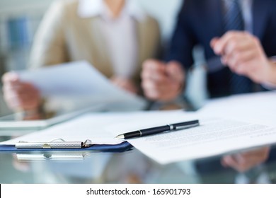 Business documents and pen at workplace - Powered by Shutterstock