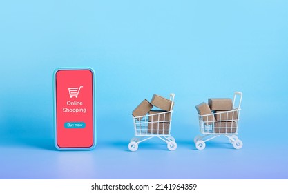 Business ecommerce or online shopping concepts with smartphone and product box order in trolley.marketplace and transportation service.copy space