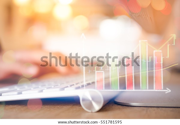 Business economic and technology working concept. Woman hand using mouse pc double exposure graph money stock trading up trend green arrow bokeh background. Vintage tone filter effect color style. 